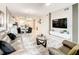 Open living space with modern decor and a large TV at 4741 Clock Tower Dr # 205, Kissimmee, FL 34746