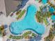 Resort-style pool with plenty of lounge chairs at 4741 Clock Tower Dr # 205, Kissimmee, FL 34746