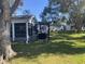 Relaxing backyard with screened patio and lush lawn at 5062 El Destino Dr, Leesburg, FL 34748