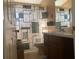 Clean bathroom with shower/tub combo and wood vanity at 5062 El Destino Dr, Leesburg, FL 34748