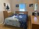 Bedroom with a full bed and wood furniture at 5062 El Destino Dr, Leesburg, FL 34748
