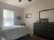 Bedroom featuring a double bed and dresser at 5062 El Destino Dr, Leesburg, FL 34748