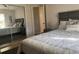 Bedroom with mirrored closet doors and a double bed at 5062 El Destino Dr, Leesburg, FL 34748