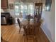 Bright dining area with wood table and chairs near kitchen and screened porch at 5062 El Destino Dr, Leesburg, FL 34748