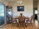 Cozy dining area with wood table and chairs, hardwood floors, and built in hutch at 5062 El Destino Dr, Leesburg, FL 34748