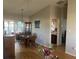 Spacious dining area with hardwood floors, and access to kitchen and bathroom at 5062 El Destino Dr, Leesburg, FL 34748