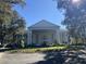Elegant two-story home with classic columns and landscaping at 5062 El Destino Dr, Leesburg, FL 34748