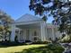Grand two-story home with stately columns and landscaping at 5062 El Destino Dr, Leesburg, FL 34748