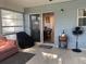 Screened porch with seating and access to backyard at 5062 El Destino Dr, Leesburg, FL 34748