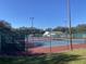 Community tennis courts with surrounding fencing at 5062 El Destino Dr, Leesburg, FL 34748