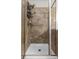 Shower with glass enclosure and tile surround at 902 Charo Pkwy # 636, Davenport, FL 33897