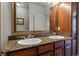 Double vanity bathroom with granite countertop at 902 Charo Pkwy # 636, Davenport, FL 33897