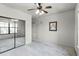 Bedroom with mirrored closet and view into adjacent room at 902 Charo Pkwy # 636, Davenport, FL 33897
