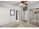 Spacious bedroom with mirrored closet doors and access to hallway at 902 Charo Pkwy # 636, Davenport, FL 33897