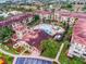 Community center with pool and landscaped courtyard at 902 Charo Pkwy # 636, Davenport, FL 33897