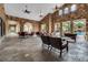 Outdoor community room with stone walls and comfortable seating at 902 Charo Pkwy # 636, Davenport, FL 33897