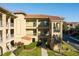 Exterior view of a multi-story building with balconies and landscaping at 902 Charo Pkwy # 636, Davenport, FL 33897