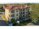 Spanish-style condo building with tile roofs and balconies at 902 Charo Pkwy # 636, Davenport, FL 33897