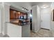 Modern kitchen with dark wood cabinets and granite countertops at 902 Charo Pkwy # 636, Davenport, FL 33897