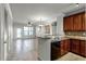 Open concept kitchen with granite countertops and stainless steel appliances at 902 Charo Pkwy # 636, Davenport, FL 33897