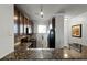 Granite countertop kitchen island with double sink and dishwasher at 902 Charo Pkwy # 636, Davenport, FL 33897