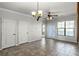 Living room with tile floors, ceiling fan and access to balcony at 902 Charo Pkwy # 636, Davenport, FL 33897