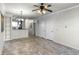 Open living room with tile floors and ceiling fan at 902 Charo Pkwy # 636, Davenport, FL 33897