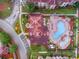 Community pool with surrounding lounge chairs and landscaping at 902 Charo Pkwy # 636, Davenport, FL 33897