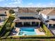 Aerial view showing home, pool, and surrounding community at 7639 Wilmington Loop, Kissimmee, FL 34747
