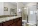 Bathroom with shower, toilet and granite vanity at 7639 Wilmington Loop, Kissimmee, FL 34747