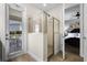 Bathroom with walk-in shower and access to bedroom and patio at 7639 Wilmington Loop, Kissimmee, FL 34747