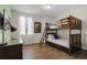 bedroom with bunk bed and built-in desk at 7639 Wilmington Loop, Kissimmee, FL 34747