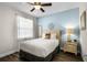 Guest bedroom with a full-size bed and light blue walls at 7639 Wilmington Loop, Kissimmee, FL 34747