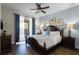 Spacious Primary bedroom with king bed and private balcony access at 7639 Wilmington Loop, Kissimmee, FL 34747