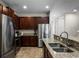 Kitchen features stainless steel appliances and granite countertops at 7639 Wilmington Loop, Kissimmee, FL 34747