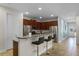 Modern kitchen with stainless steel appliances and granite countertops at 7639 Wilmington Loop, Kissimmee, FL 34747