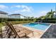 Relaxing pool and spa area with lounge chairs at 7639 Wilmington Loop, Kissimmee, FL 34747