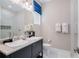 Clean bathroom with double sinks and plenty of counter space at 812 Desert Mountain Ct, Reunion, FL 34747