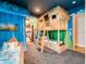 Themed bedroom with a bunk bed, playful mural, and whimsical decor at 812 Desert Mountain Ct, Reunion, FL 34747