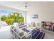 Spacious patio with comfortable seating, a flat-screen TV, and tranquil views at 812 Desert Mountain Ct, Reunion, FL 34747