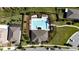 Aerial view of community pool, clubhouse, and surrounding homes at 12749 Brodlove Lane, Winter Garden, FL 34787