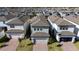 Aerial view of three houses with attached garages at 12749 Brodlove Lane, Winter Garden, FL 34787
