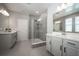 Modern bathroom with double vanities and a large glass shower at 12749 Brodlove Lane, Winter Garden, FL 34787