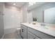Bathroom with double vanity and white tile at 12749 Brodlove Lane, Winter Garden, FL 34787