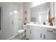 Modern bathroom with a walk-in shower, white vanity, and stylish decor at 12749 Brodlove Lane, Winter Garden, FL 34787