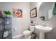Clean bathroom with a white vanity, toilet, and updated fixtures at 12749 Brodlove Lane, Winter Garden, FL 34787