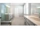 Elegant bathroom with double vanity and a large walk-in shower at 12749 Brodlove Lane, Winter Garden, FL 34787