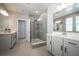 Spa-like bathroom with double sinks, large shower, and modern fixtures at 12749 Brodlove Lane, Winter Garden, FL 34787