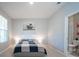 Spacious bedroom with a comfortable bed, large window and en-suite bathroom at 12749 Brodlove Lane, Winter Garden, FL 34787