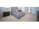 Cozy bedroom featuring a bed and nightstands with lamps at 12749 Brodlove Lane, Winter Garden, FL 34787